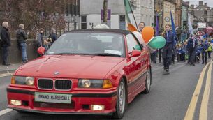 <p>Grand marshall Frank Taaffe driven by Seamus Fahy through Athy on St Patrick's Day Photo: Aisling Hyland</p>
