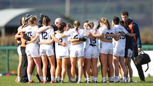 <p>The Kildare team in a huddle with manager Pat Sullivan after defeat to Kerry confirmed their relegation to Division 2</p>