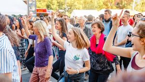 Line dancing flash mob taking place in Ahty
