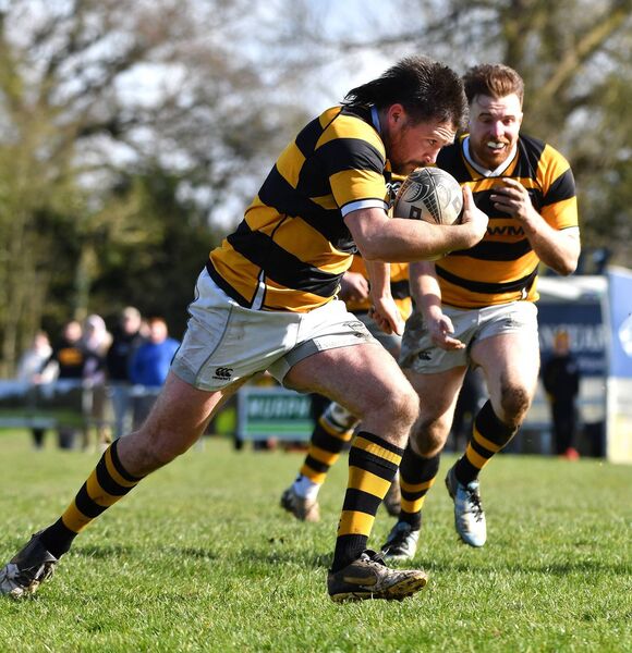 Newbridge player/coach Robbie Waters drivers for the line for the his side's second try.