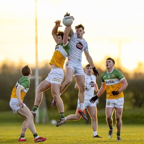 TJ Nolan beats Offaly's Eoin Dunne to a high ball Photo: James Lawlor