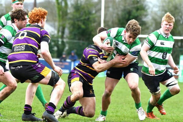 Naas fly half Paddy Taylor drives through the defensive line. Naas fly half Paddy Taylor drives through the defensive line.