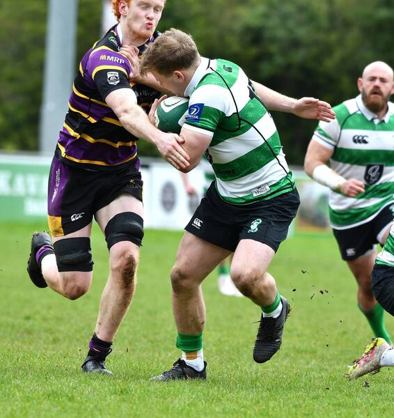 Charlie Sheridan Naas holds off Instonians blindside Mark Lee. Charlie Sheridan Naas holds off Instonians blindside Mark Lee.