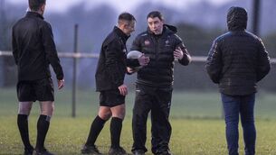 <p>Referee Ian Howley speaks with Kildare manager Niall Cronin before making the decision to abandon this evening's Leinster U20 Football Championship quarter-final at half time Photo: James Lawlor</p>