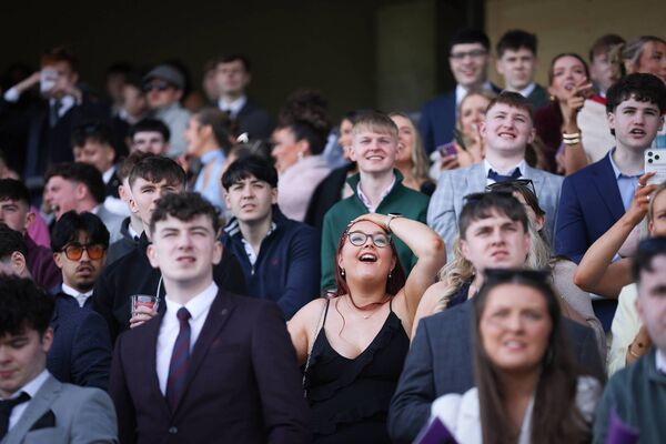 Racegoers watch on Racegoers watch on
