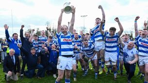 <p>Captain Craig Miller lifts the Bank of Ireland Leinster Towns Cup after Athy's dominant win over Tullow in Edenderry. All Photos: Matt Browne/Sportsfile</p>