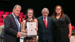 <p>Holy Family Secondary School's Jessica Fleming with Niamh Flynn Múinteoir Gaeilge agus Teicneolaíochta and patrons JP McManus and Willie O'Dea TD</p>