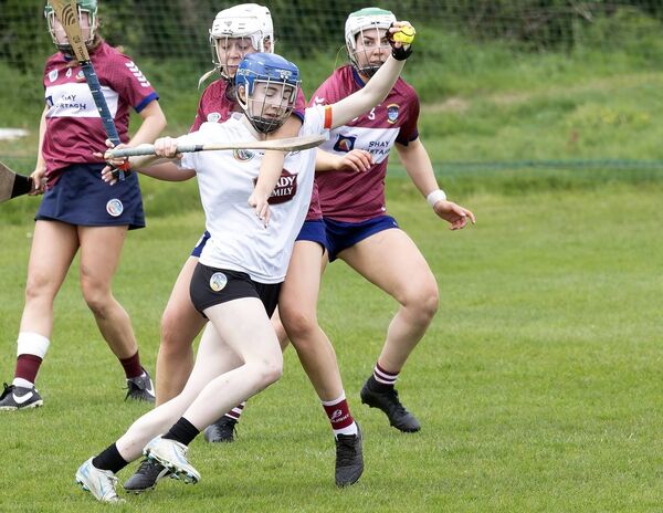 Kildare's Rebecca McDermott tries to squeeze past the Westmeath defence. All Photos: Sean Brilly.