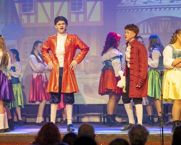 Joe Moore as Gaston and Theo Giles as Lefou. 