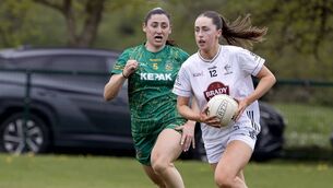 <p>Kildare's Molly Aspell races clear of Meath's Orlaith Sheehy during today's game in Summerhill Photo: Sean Brilly</p>