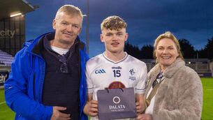 <p>Ronan Kelly with Difference Maker award, and parents Leo and Suzanne Photo: ©INPHO/Tom O’Hanlon</p>