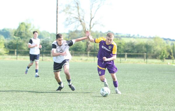 Adam Whelan in a tussle with Filip Kopczak of Wexford 