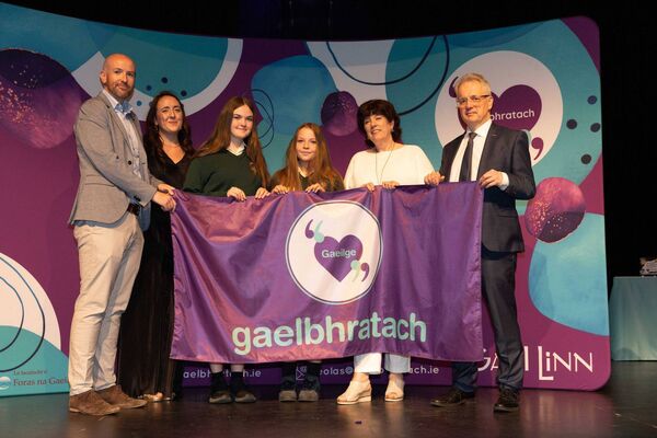 Students from Coláiste Chiaráin, Leixlip, are presented with their Gaelbhratach (Irish flag) at Mary Immaculate College this week. Photo: Eamon Ward. Students from Coláiste Chiaráin, Leixlip, are presented with their Gaelbhratach (Irish flag) at Mary Immaculate College this week. Photo: Eamon Ward.