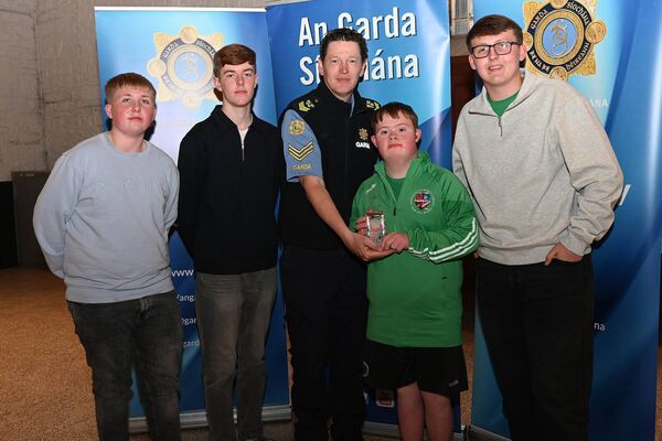 Group Award St Kevins GAA all Stars Darragh Bagnall McGinley, Oisin Curran, James Henehan, Eoin Collins an presented by Sgt John Dunne Group Award St Kevins GAA all Stars Darragh Bagnall McGinley, Oisin Curran, James Henehan, Eoin Collins an presented by Sgt John Dunne