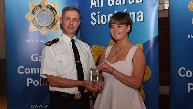 <p>Overall winner Aine Sheerin from Miltown presented by Supt Mills </p>
