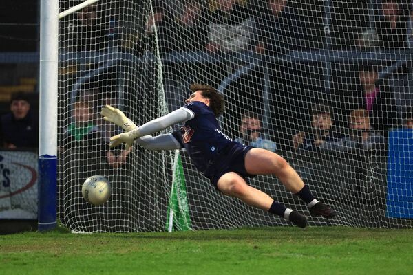 Joe Crotty saves Harry McGuirk's penalty during the shoot-out Photo: ©INPHO/Bryan Keane