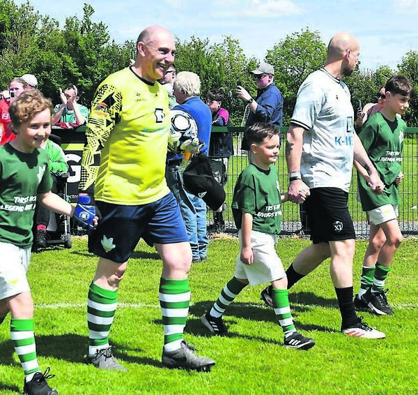 Captains Joe O’Rourke and Jaap Stam lead the teams and mascots out onto the pitch. Captains Joe O’Rourke and Jaap Stam lead the teams and mascots out onto the pitch.