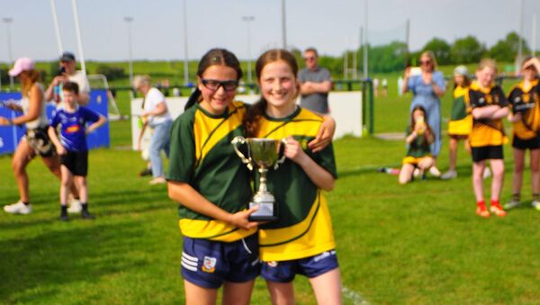 St Patrick's Celbridge players Isabel Martin and Sienna Horan celebrate with the Division 7 trophy. St Patrick's Celbridge players Isabel Martin and Sienna Horan celebrate with the Division 7 trophy.