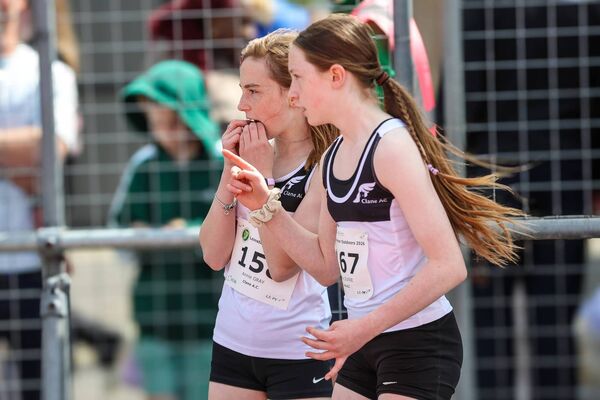 Annie Gray (left) and Hayley Dunne (right) look on as Gray's Pole Vault record is verified. Annie Gray (left) and Hayley Dunne (right) look on as Gray's Pole Vault record is verified.