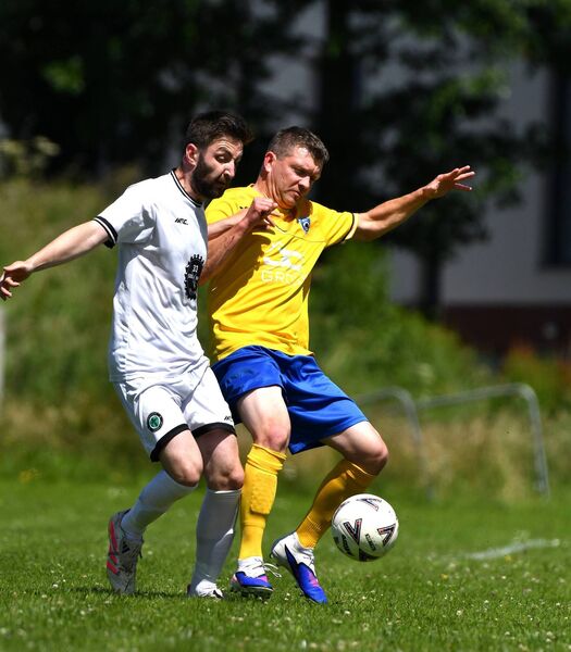 William O'Shea (Corbans Celtic) and Joe Grehan (Enfield) battle for the ball William O'Shea (Corbans Celtic) and Joe Grehan (Enfield) battle for the ball