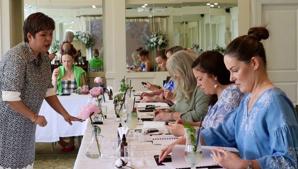 Eileen Tan explaining how to make bespoke fragrances.