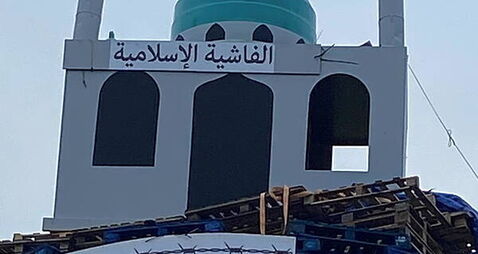 Replica of mosque placed on top of loyalist bonfire in Tyrone