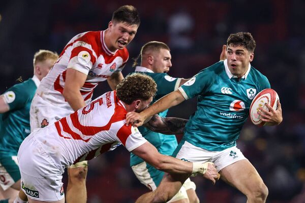 Jimmy O'Brien is tackled by Japan's Warner Dearns 