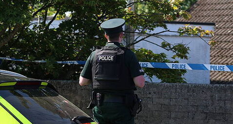 Police remain at the scene after three relatives found dead in family home
