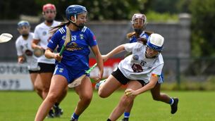 <p>Niamh Mortell keeps the ball for Kildare under pressure from Cavan's Niamh Keenaghan when the teams met earlier in the year</p>