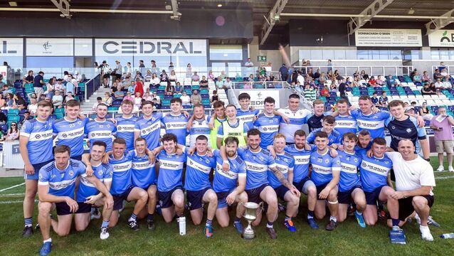 <p>Allenwood celebrate after winning the Senior Football League Division 2 title</p>