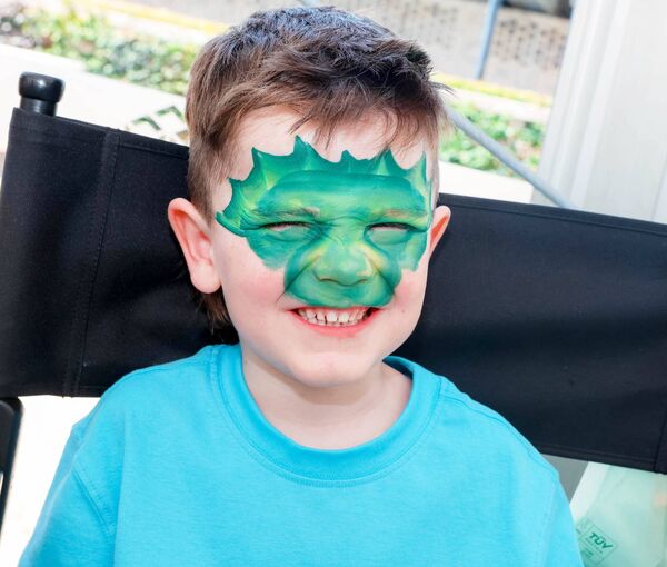 CJ Foley getting his face painted at the Curragh Racecourse CJ Foley getting his face painted at the Curragh Racecourse