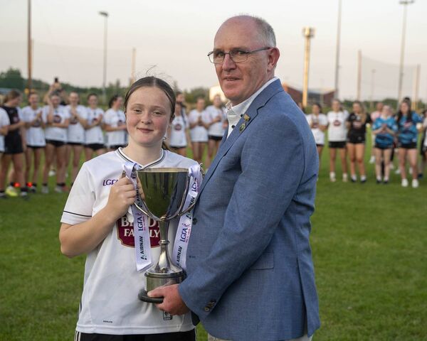 Capatin Amy Wall for Kildare receives the All-Ireland trophy from LGFA President Arthur Corrigan Photo: Aisling Hyland Capatin Amy Wall for Kildare receives the All-Ireland trophy from LGFA President Arthur Corrigan Photo: Aisling Hyland