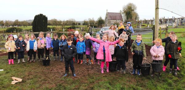 Junior students of St Colmcille celebrate the completion of planting and mulching 100 new trees on their grounds Junior students of St Colmcille celebrate the completion of planting and mulching 100 new trees on their grounds