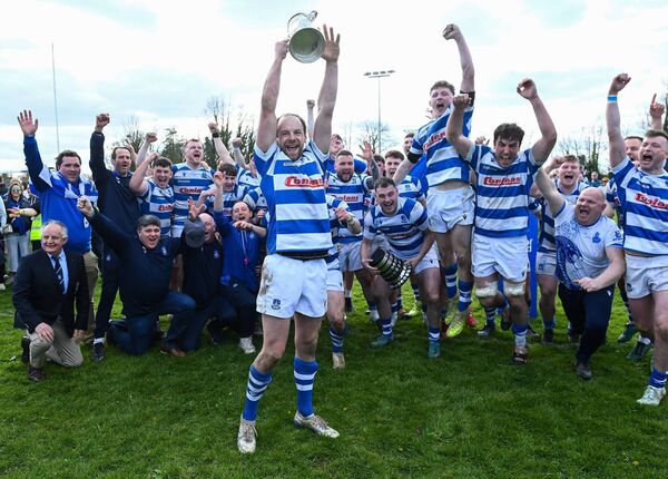 Athy captain Craig Miller hoists the 2026 Provincial Towns Cup. Photo: Matt Browne/Sportsfile.