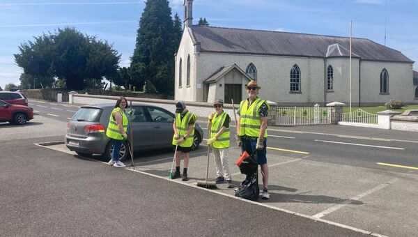 The Moore &amp; Clarke families taking part in the clean-up