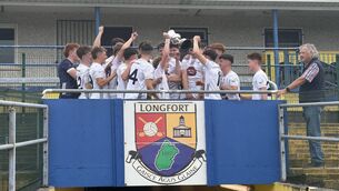 <p>Kildare captain Sean O'Carroll lifts the Fr. Manning Cup Photo: Ger McNally</p>