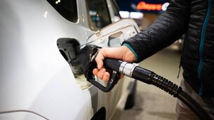 <p>Stock image of man putting diesel in a car</p>