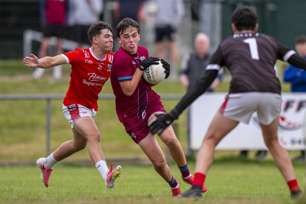 Oliver Plunketts's Charlie Murphy is closed down by Athy's Adam Zdybik and Ben Dalton. Oliver Plunketts's Charlie Murphy is closed down by Athy's Adam Zdybik and Ben Dalton.