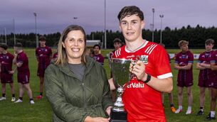 <p>Athy's Calum Keavney is presented with the trophy by Christine Murray.</p> <p>Athy's Calum Keavney is presented with the trophy by Christine Murray.</p>