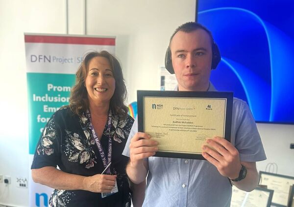 Aodhán McFadden being presented his certificate Aodhán McFadden being presented his certificate