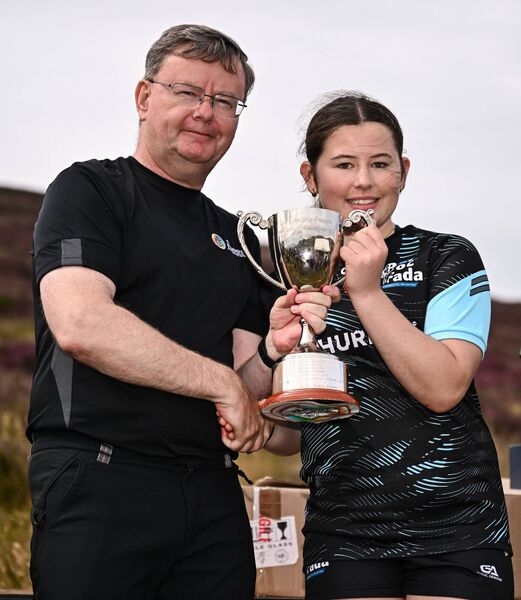 Uachtarán an Cumann Camógaíochta Brian Molloy presents the U16 Camogie trophy to Eloise McConn Photo by Ben McShane/Sportsfile Uachtarán an Cumann Camógaíochta Brian Molloy presents the U16 Camogie trophy to Eloise McConn Photo by Ben McShane/Sportsfile