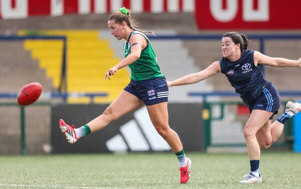 Shauna Kendrick punts the ball for Ireland during the AFLW Test Match at Virgin Media Park, Cork Photo: ©INPHO/Nick Elliott