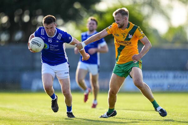 Castledermot's Gavin Farrell in possession, with TMH defender Peter Kelly for company. Photos: James Lawlor. Castledermot's Gavin Farrell in possession, with TMH defender Peter Kelly for company. Photos: James Lawlor.