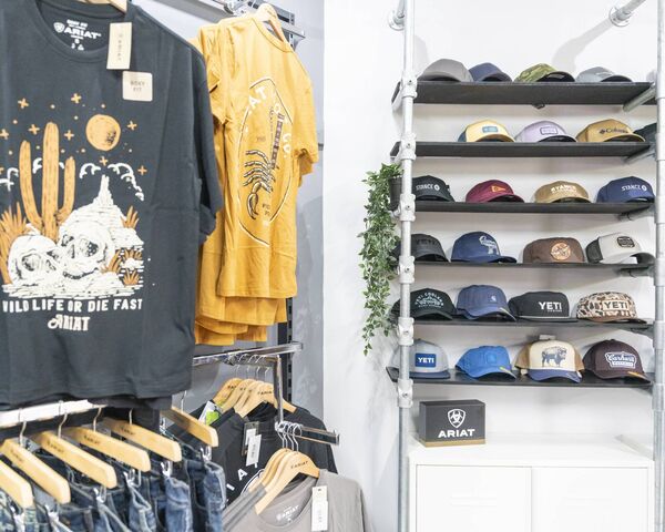 Selection of hats and tshirts in store Selection of hats and tshirts in store