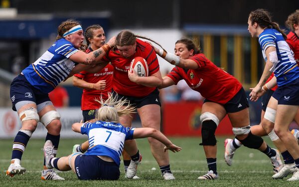Kildare's Ruth Campbell and Roisín Kinch tackle Munster's Jane Clohessy. Photo: INPHO/Ben Brady Kildare's Ruth Campbell and Roisín Kinch tackle Munster's Jane Clohessy. Photo: INPHO/Ben Brady