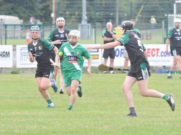 Gary Breslin of Sarsfields charges through the Wolfe Tones defence. Photo: Martin Rowe 