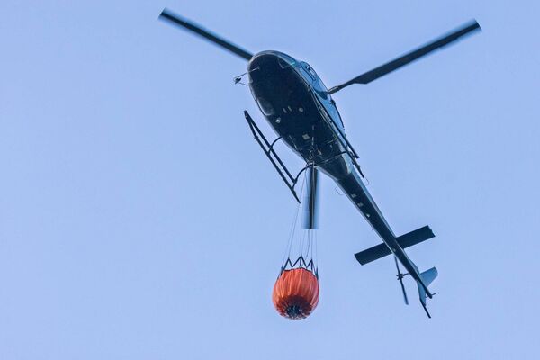Helicopter and Bambi bucket taken by local resident Eddie Bond