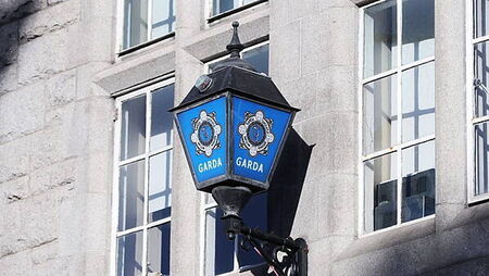 Garda charged with soliciting murder of woman and three children