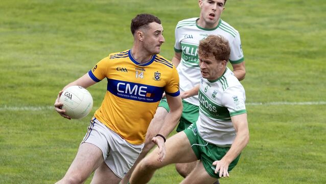 <p>Raheens' Jack Taaffe goes around Sallins' Eoin McConnon. Photo: Sean Brilly.</p>