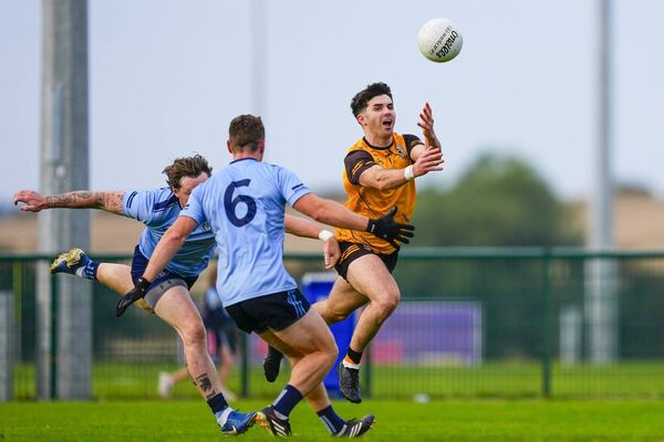 Clogherinkoe's Jack Robinson pops the ball away from the Eadestown defenders. Clogherinkoe's Jack Robinson pops the ball away from the Eadestown defenders.